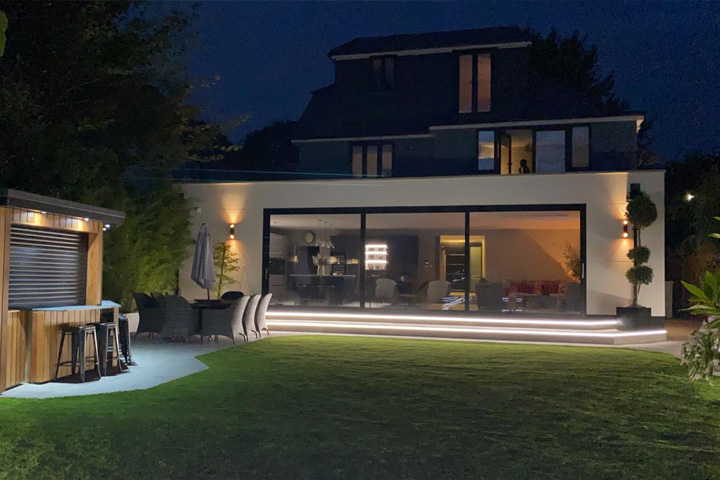 Pic showing a night photograph of a Kentstruction house extension