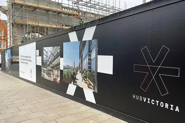Pic showing some information hoarding outside a building site in London